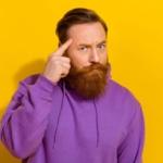 man touches brain to show a good idea
